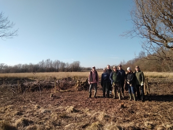 A group of volunteers at Rhos Cefn Bryn on a sunny winter's day. 