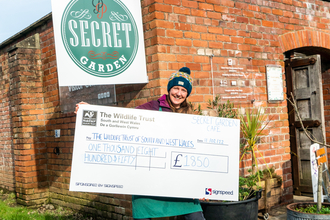 Fundraiser holding a jumbo cheque