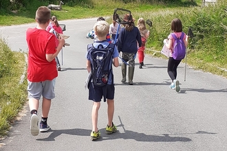 Children carrying pond dipping nets