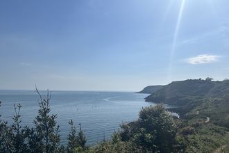 View of coastline on a sunny day.