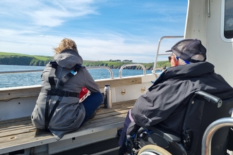 Two people on a boat.