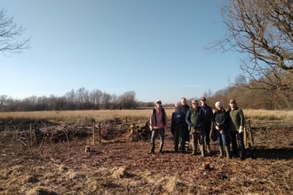A group of volunteers at Rhos Cefn Bryn on a sunny winter's day. 