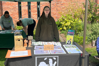Ella at stall at Plant Fair. 
