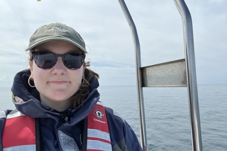 Bea in a boat a sea.