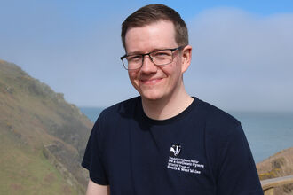 Martin in a WTSWW t-shirt in Martin's Haven. 