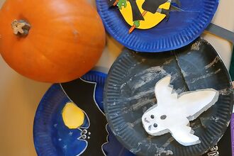 paper plates painted with halloween scenes