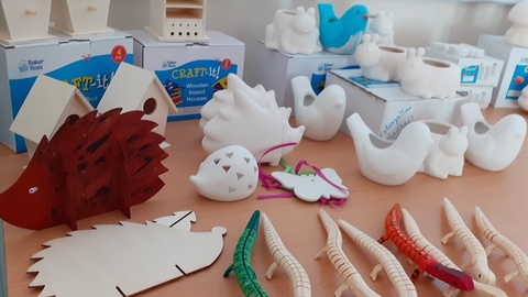 Display of items to paint including coin banks, planters, bird houses and bug homes