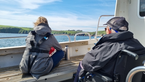 Two people on a boat.