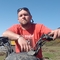 Paul on a quad bike on a sunny day. 
