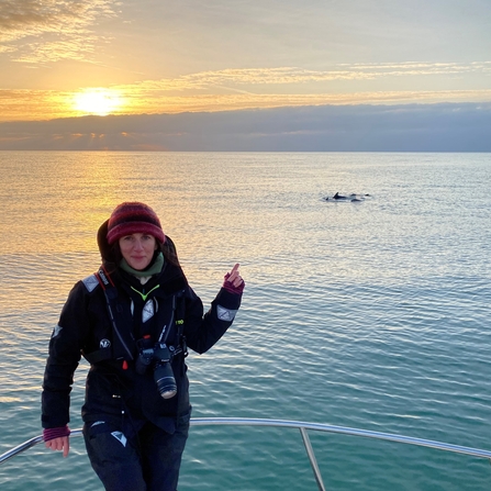 Dr Sarah Perry, surveying dolphins