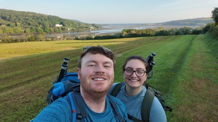 Fundraisers Joe and Maddy in a field while on their walk