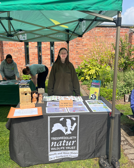 Ella at stall at Plant Fair.
