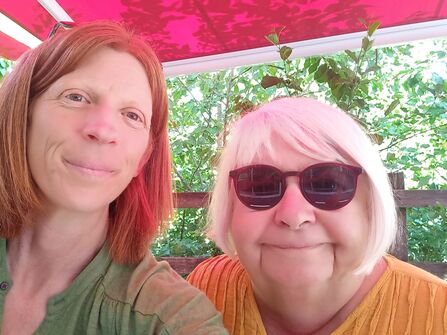 A selfie of two women smiling at the camera