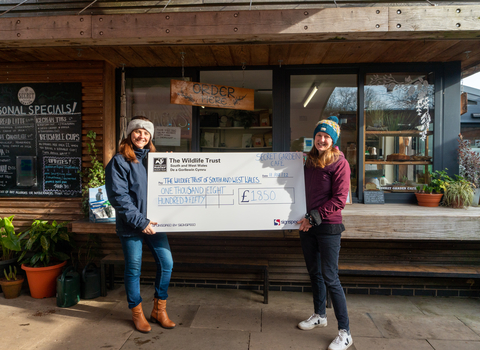 Staff with fundraisers at secren garden cafe