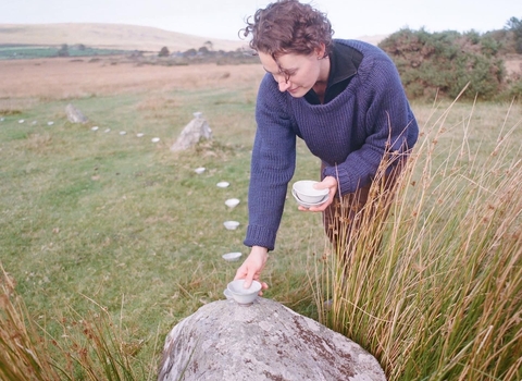 Linda Unsworth laying down a wild clay bowl