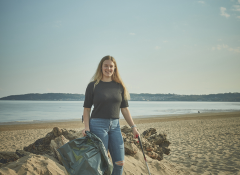 Community member litter picking Swansea beach