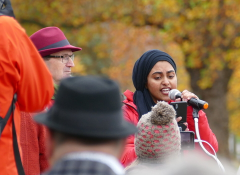 woman speaking at climate march